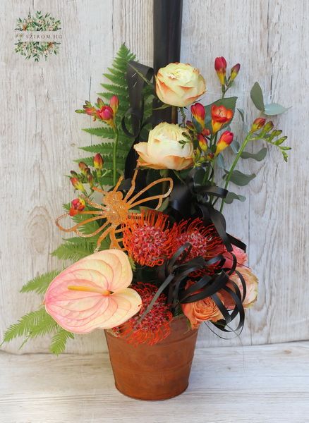 Rusty pot tropical flowers and roses