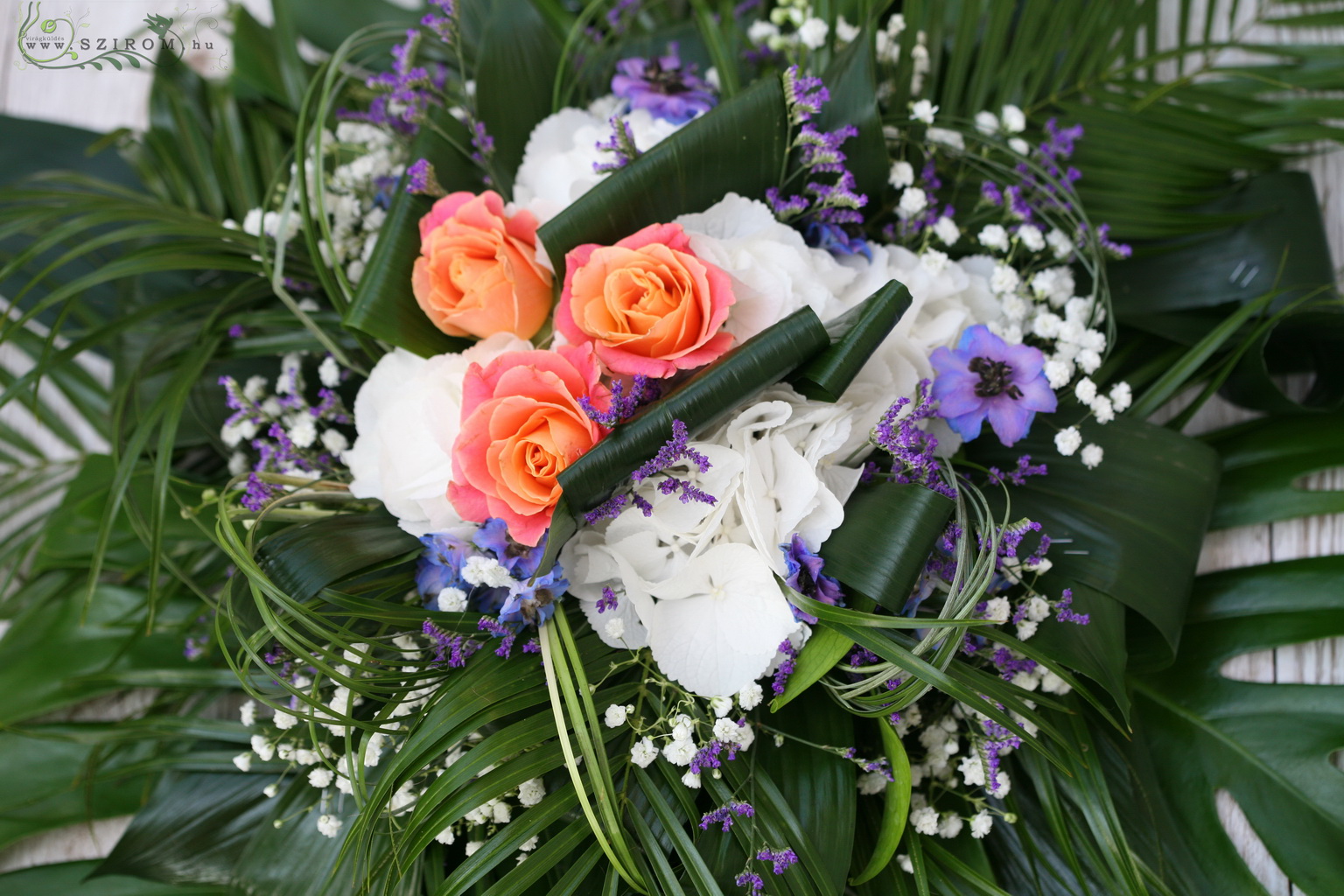 flower delivery Budapest - car flower arrangement with roses, hydrangeas, statice, baby's breathe, sesonal flowersm orange, white, blue, purple)