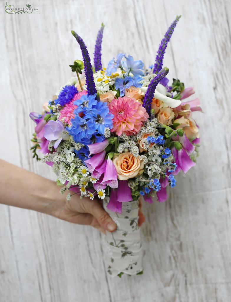 Bridal bouquet with mixed wild flowers (veronica, dahlia, delphinium) summer, early autumn
