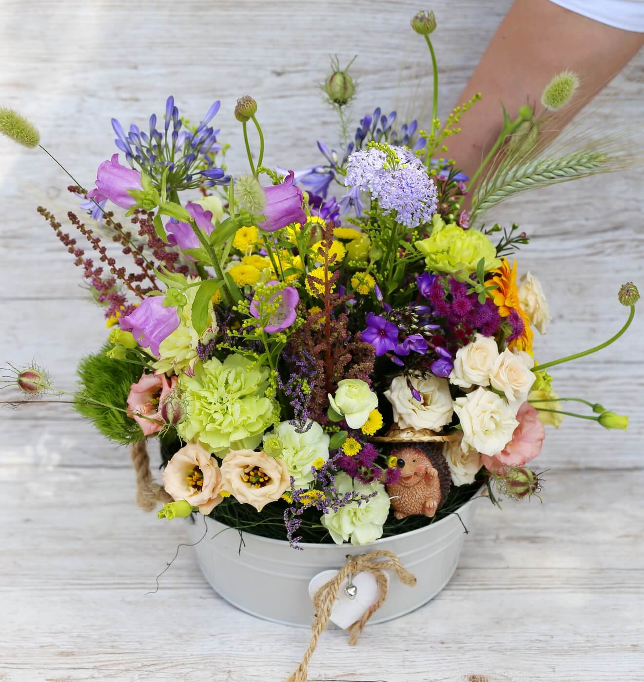 flower delivery Budapest - Big zinc bowl with summer meadow style flowers, hedgehog figure (29 stems)