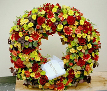 flower delivery Budapest - flower wreath orange-red (65cm)