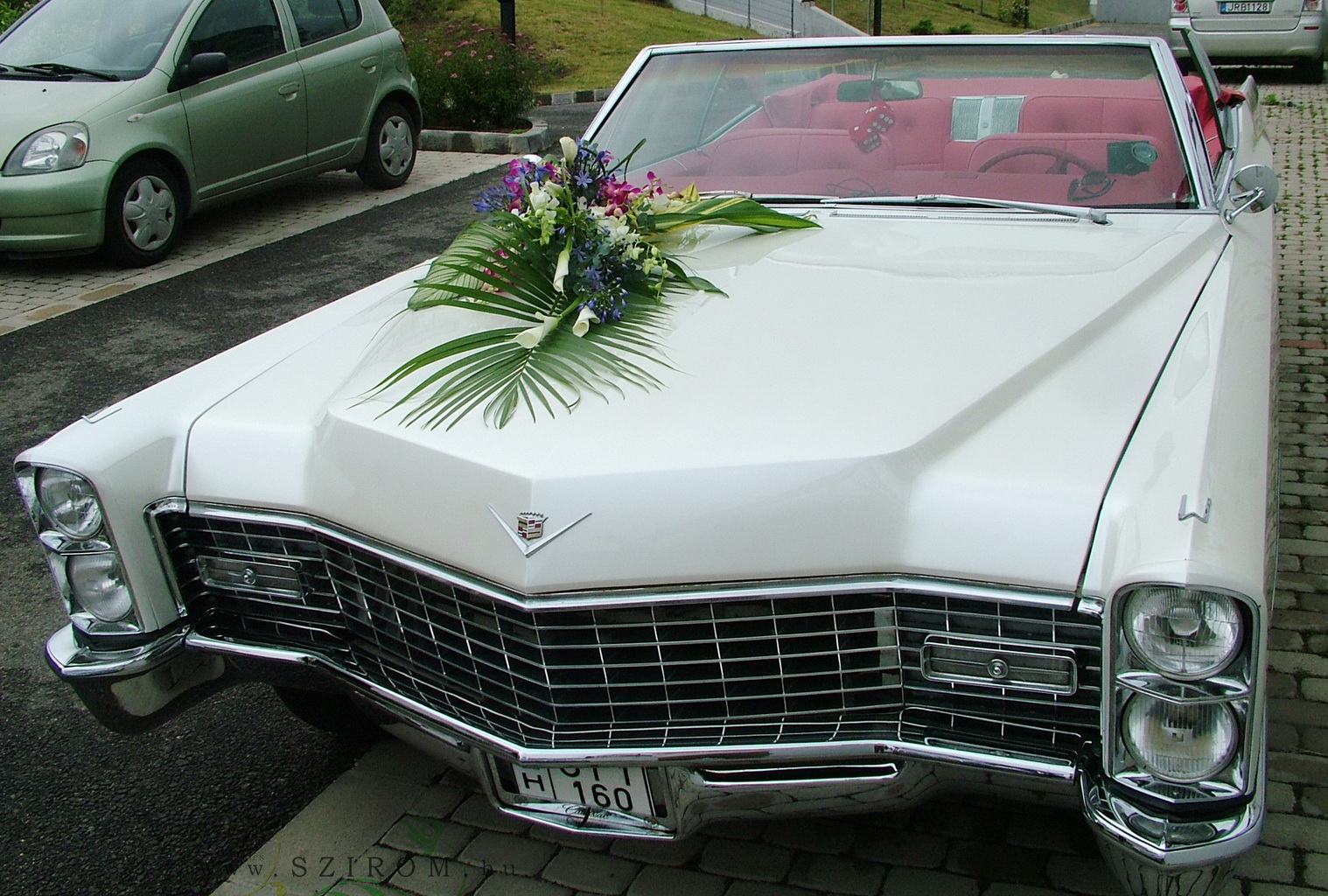 flower delivery Budapest - teardrop car flower arrangement with orchids (cala, agapanthus, white, blue, pink)