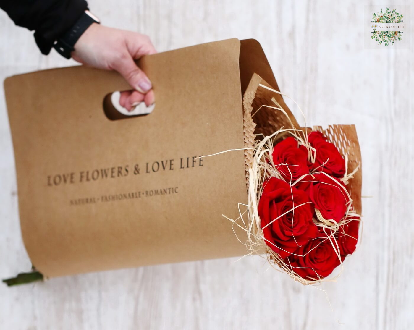 flower delivery Budapest - 7 red roses in modern craft paper bag